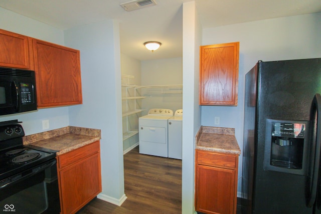 10610 Pavilion Dr, Indianapolis, IN 46259 - kitchen with black appliances, washer and dryer, and dark wood-style floors