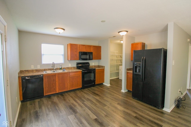 10610 Pavilion Dr, Indianapolis, IN 46259 - kitchen featuring black appliances, dark wood-style floors, brown cabinetry, and light countertops