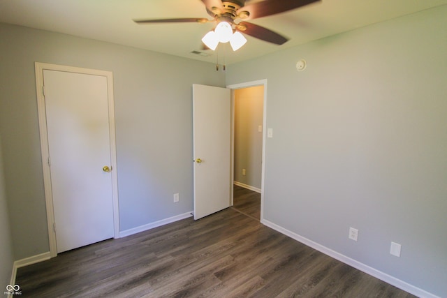 10610 Pavilion Dr, Indianapolis, IN 46259 - unfurnished bedroom featuring dark wood-type flooring and ceiling fan