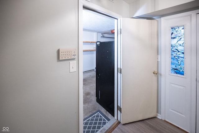 7151 Sea Pine Dr, Indianapolis, IN 46250 - corridor featuring wood finished floors and baseboards