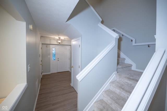 7151 Sea Pine Dr, Indianapolis, IN 46250 - entryway with stairs and wood finished floors