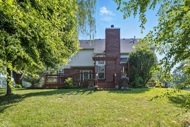 13004 Tuscany Blvd, Carmel, IN 46032 - back of house with a lawn, a chimney, brick siding, and a deck