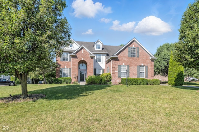 13004 Tuscany Blvd, Carmel, IN 46032 - traditional-style house with brick siding and a front lawn