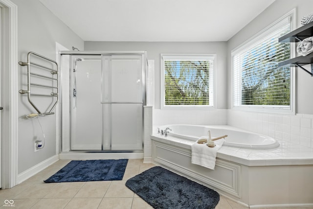 13004 Tuscany Blvd, Carmel, IN 46032 - bathroom featuring a garden tub, a shower stall, and tile patterned floors