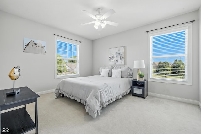 13004 Tuscany Blvd, Carmel, IN 46032 - bedroom featuring light colored carpet, multiple windows, and ceiling fan