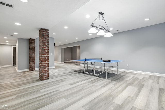 13004 Tuscany Blvd, Carmel, IN 46032 - rec room with decorative columns, light wood finished floors, and recessed lighting