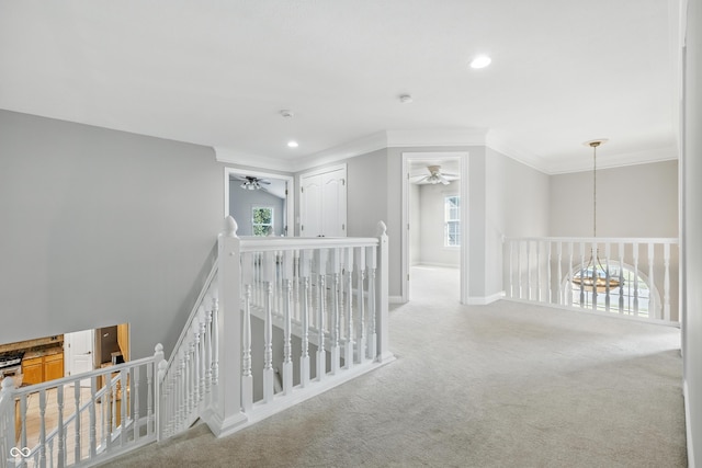 13004 Tuscany Blvd, Carmel, IN 46032 - hallway featuring an upstairs landing, ornamental molding, carpet floors, and recessed lighting