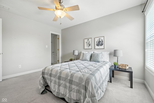 13004 Tuscany Blvd, Carmel, IN 46032 - bedroom featuring light colored carpet, multiple windows, and a ceiling fan