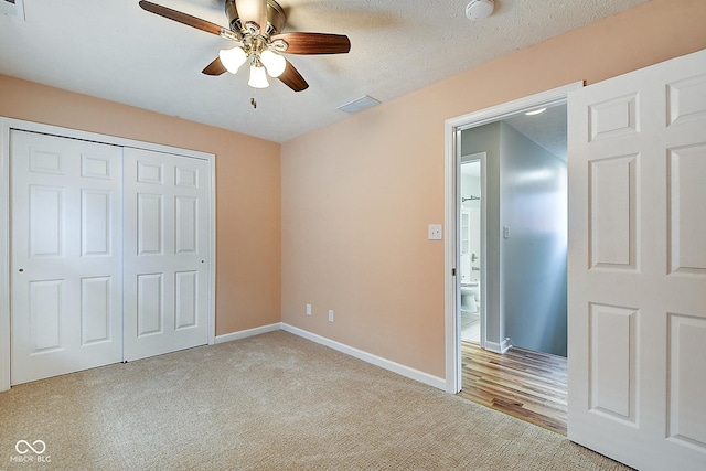 1319 E Michigan St, Indianapolis, IN 46202 - unfurnished bedroom with a closet, carpet flooring, and a ceiling fan