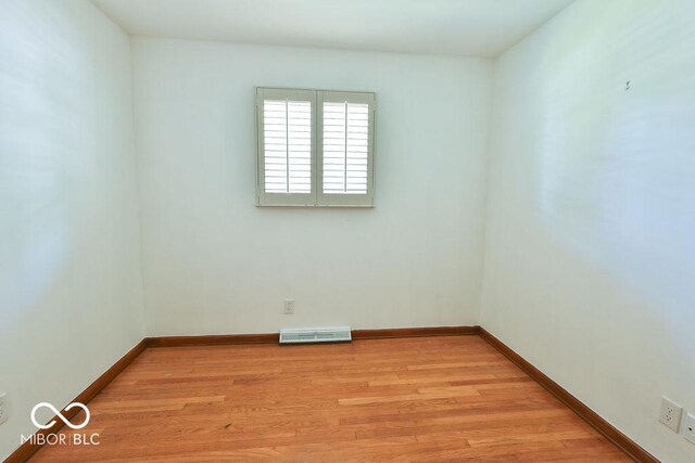 7525 Surrey Dr, Indianapolis, IN 46227 - spare room featuring light wood-style flooring and baseboards