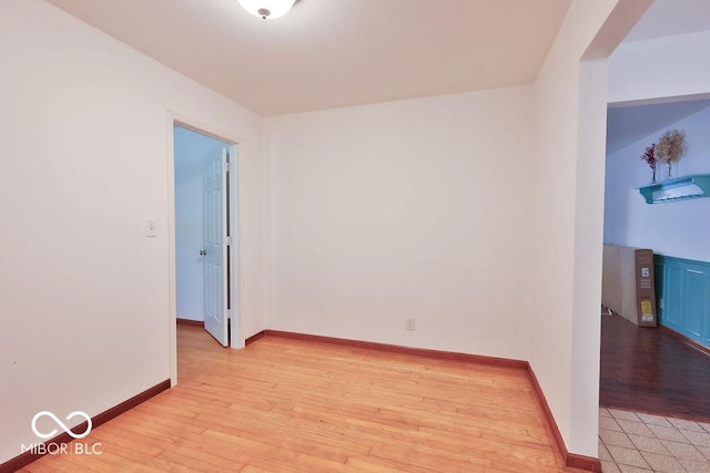 7525 Surrey Dr, Indianapolis, IN 46227 - spare room with light wood-type flooring and baseboards