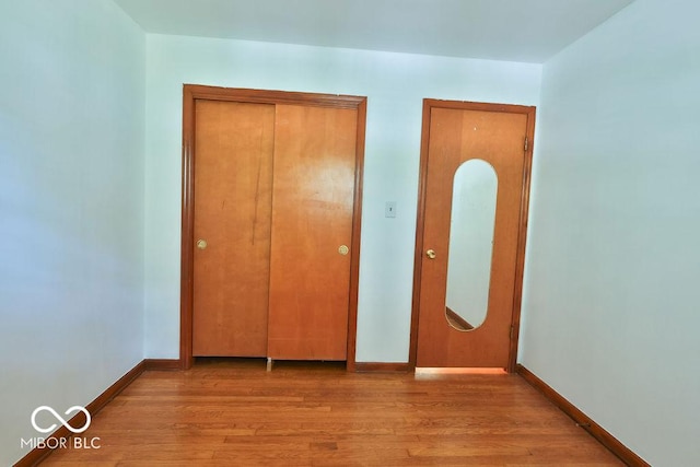 7525 Surrey Dr, Indianapolis, IN 46227 - unfurnished bedroom with wood finished floors