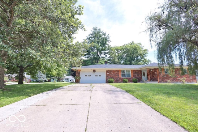 7525 Surrey Dr, Indianapolis, IN 46227 - ranch-style house with a garage, driveway, brick siding, and a front yard
