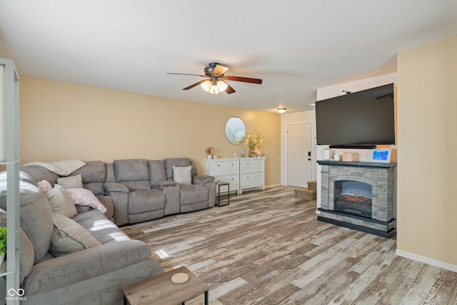 2564 Woodfield Blvd, Franklin, IN 46131 - living room with light wood-style flooring, a ceiling fan, and a fireplace