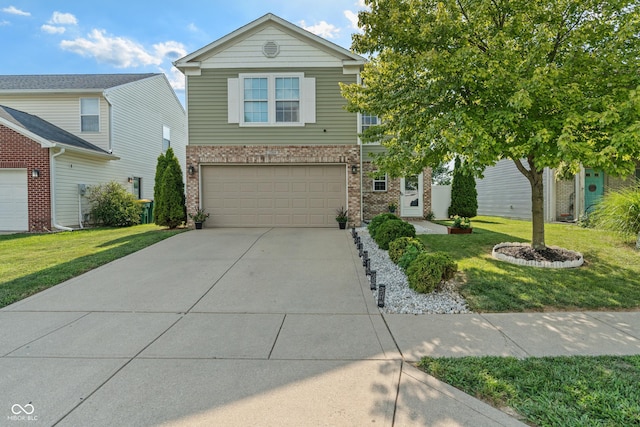 2564 Woodfield Blvd, Franklin, IN 46131 - view of front of property with brick siding, driveway, a garage, and a front yard