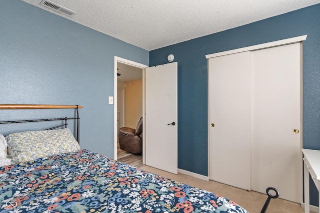 2564 Woodfield Blvd, Franklin, IN 46131 - bedroom featuring light carpet, a closet, and a textured ceiling