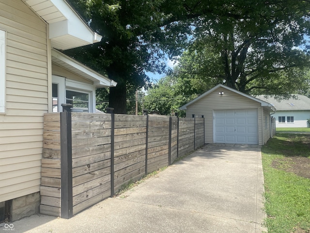 5220 Crawfordsville Rd, Speedway, IN 46224 - detached garage featuring driveway