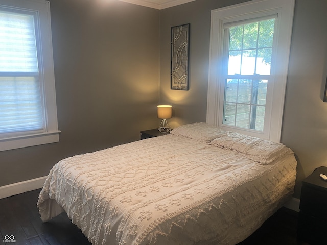 5220 Crawfordsville Rd, Speedway, IN 46224 - bedroom featuring dark wood-style flooring and ornamental molding
