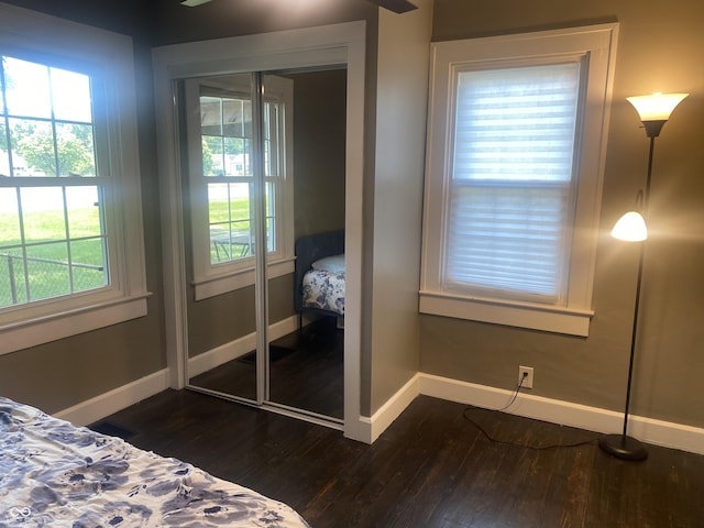 5220 Crawfordsville Rd, Speedway, IN 46224 - bedroom featuring dark wood-type flooring and multiple windows