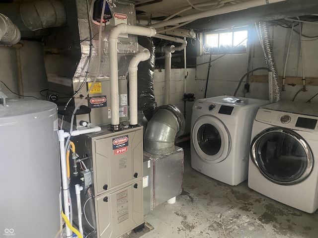 5220 Crawfordsville Rd, Speedway, IN 46224 - laundry area featuring washing machine and dryer and water heater
