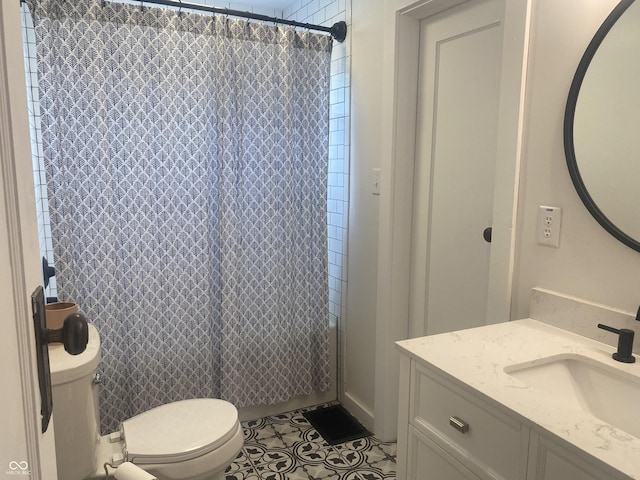 5220 Crawfordsville Rd, Speedway, IN 46224 - full bath with vanity, tile patterned floors, and a shower with shower curtain