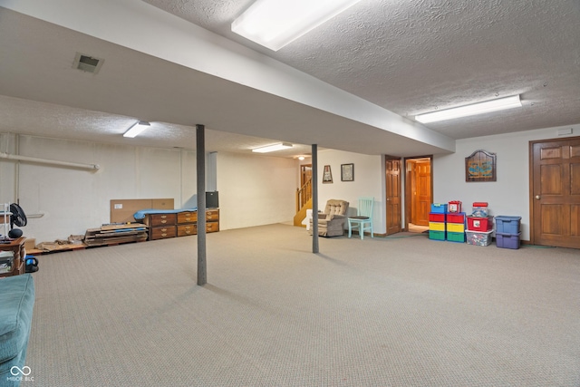 12011 Emory Dr, Indianapolis, IN 46229 - finished below grade area with a textured ceiling, carpet floors, and stairway