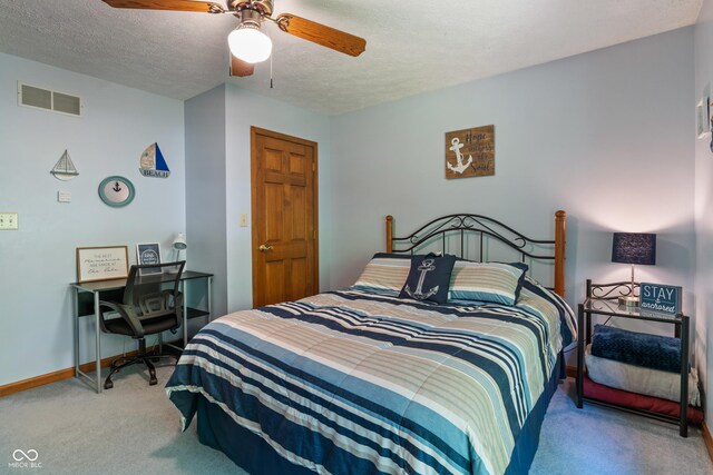 12011 Emory Dr, Indianapolis, IN 46229 - bedroom featuring carpet, a textured ceiling, and a ceiling fan