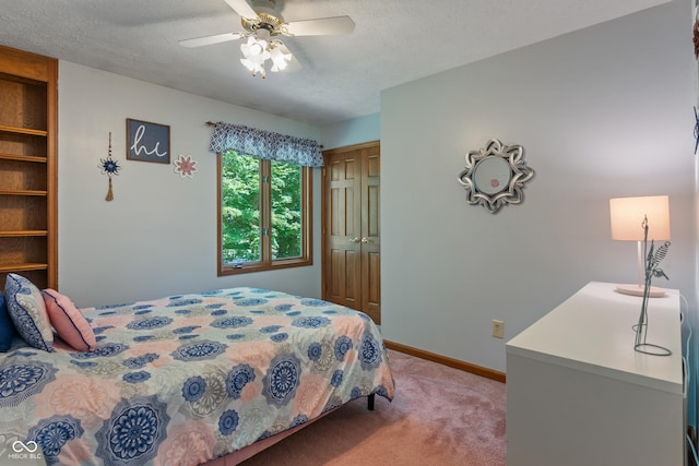 12011 Emory Dr, Indianapolis, IN 46229 - bedroom with a closet, light carpet, a textured ceiling, and ceiling fan