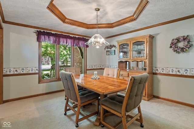 12011 Emory Dr, Indianapolis, IN 46229 - dining area with light carpet, a chandelier, a textured ceiling, ornamental molding, and a raised ceiling