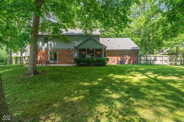 12011 Emory Dr, Indianapolis, IN 46229 - back of house featuring brick siding and a patio area