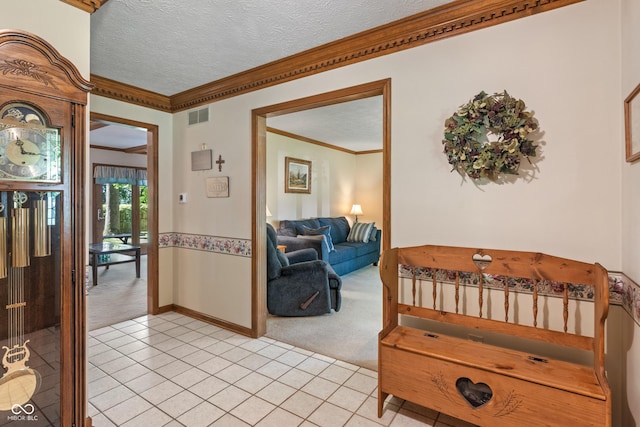 12011 Emory Dr, Indianapolis, IN 46229 - hall with light carpet, crown molding, light tile patterned floors, and a textured ceiling