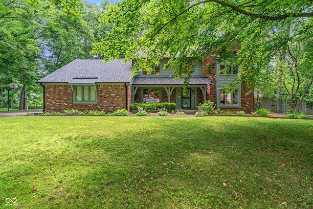 12011 Emory Dr, Indianapolis, IN 46229 - traditional-style home featuring a porch, brick siding, and a shingled roof