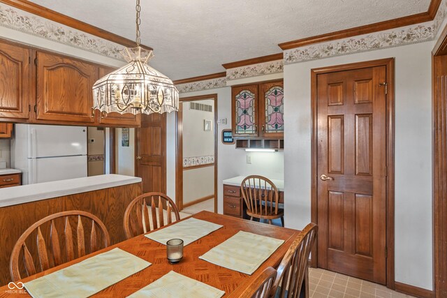12011 Emory Dr, Indianapolis, IN 46229 - dining area with a chandelier and a textured ceiling