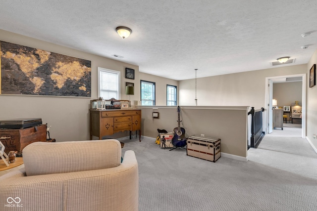 5961 Pine Bluff Dr, Avon, IN 46123 - sitting room with carpet floors and a textured ceiling