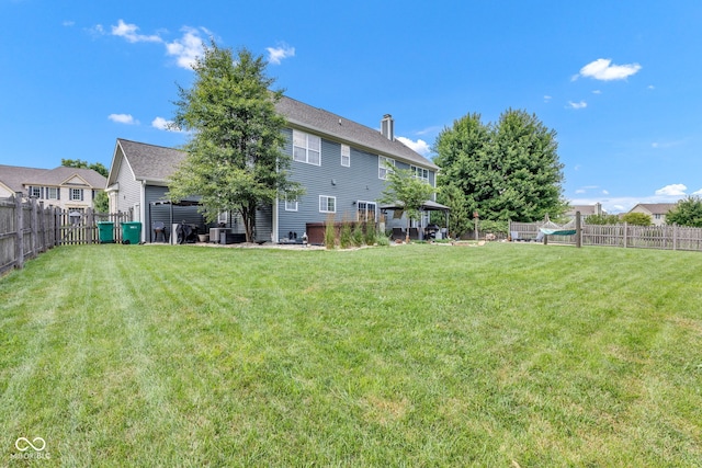 5961 Pine Bluff Dr, Avon, IN 46123 - back of property featuring a fenced backyard and a chimney