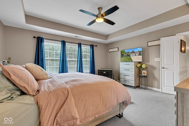 5961 Pine Bluff Dr, Avon, IN 46123 - bedroom with light colored carpet, a tray ceiling, and a ceiling fan