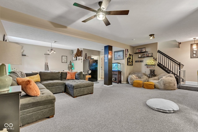 5961 Pine Bluff Dr, Avon, IN 46123 - living room featuring carpet floors, stairway, ceiling fan, and a chandelier