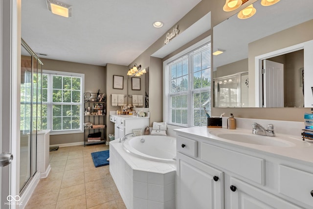 5961 Pine Bluff Dr, Avon, IN 46123 - full bath with a shower stall, two vanities, tile patterned flooring, and a bath