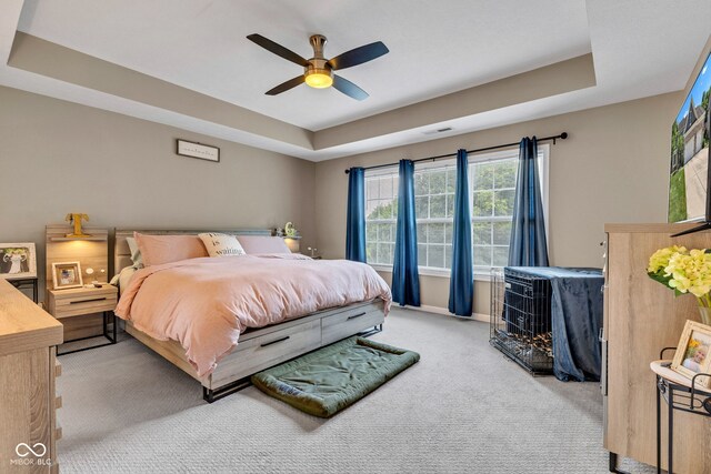 5961 Pine Bluff Dr, Avon, IN 46123 - bedroom with a tray ceiling, carpet, and ceiling fan