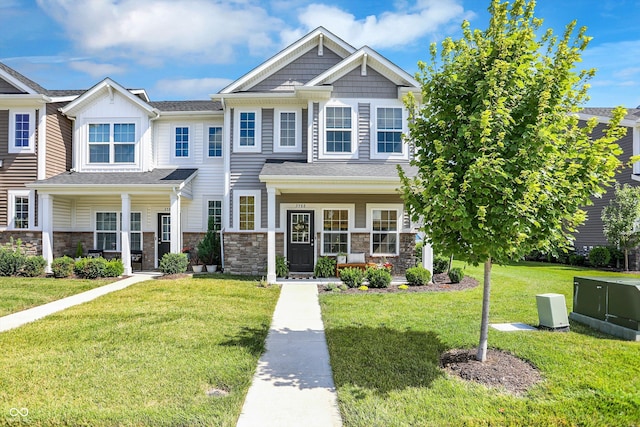 3588 Thomas Jefferson St, Westfield, IN 46074 - craftsman inspired home with covered porch, a front lawn, and stone siding
