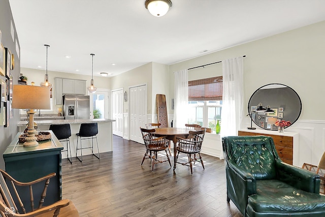 3588 Thomas Jefferson St, Westfield, IN 46074 - dining area with dark wood finished floors, a wainscoted wall, healthy amount of natural light, and a decorative wall