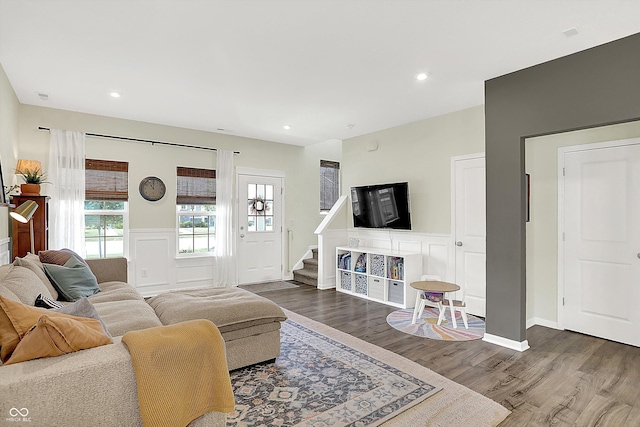3588 Thomas Jefferson St, Westfield, IN 46074 - living room featuring dark wood finished floors, a wainscoted wall, stairs, a decorative wall, and recessed lighting