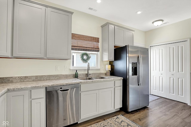 3588 Thomas Jefferson St, Westfield, IN 46074 - kitchen with appliances with stainless steel finishes, dark wood-style floors, and light countertops