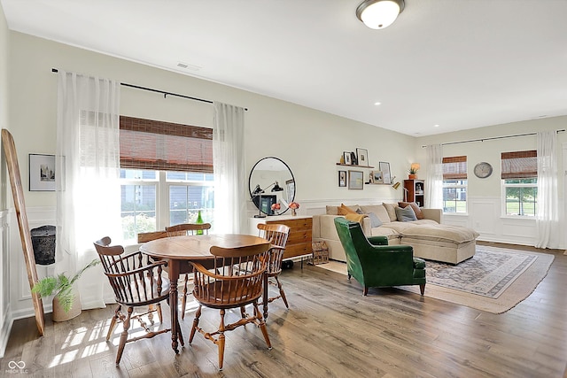 3588 Thomas Jefferson St, Westfield, IN 46074 - dining room featuring wood finished floors, healthy amount of natural light, wainscoting, and a decorative wall