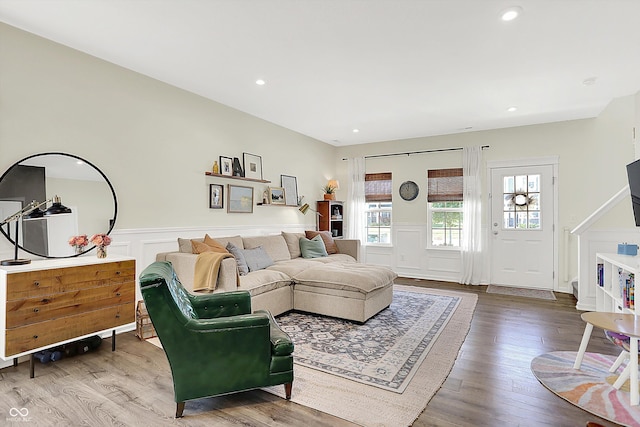 3588 Thomas Jefferson St, Westfield, IN 46074 - living area featuring wainscoting, wood finished floors, a decorative wall, recessed lighting, and stairway