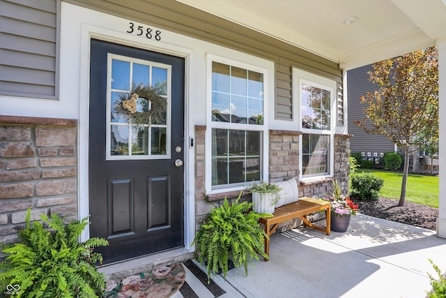 3588 Thomas Jefferson St, Westfield, IN 46074 - view of exterior entry featuring covered porch and stone siding