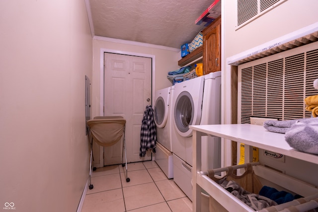 2501 Mitten Rd, Bowling Green, IN 47833 - laundry room featuring washer and dryer, light tile patterned floors, a textured ceiling, and ornamental molding
