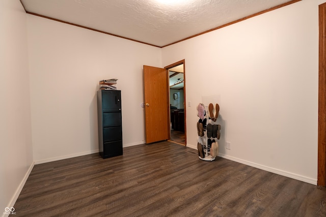 2501 Mitten Rd, Bowling Green, IN 47833 - empty room featuring dark wood finished floors, a textured ceiling, and crown molding