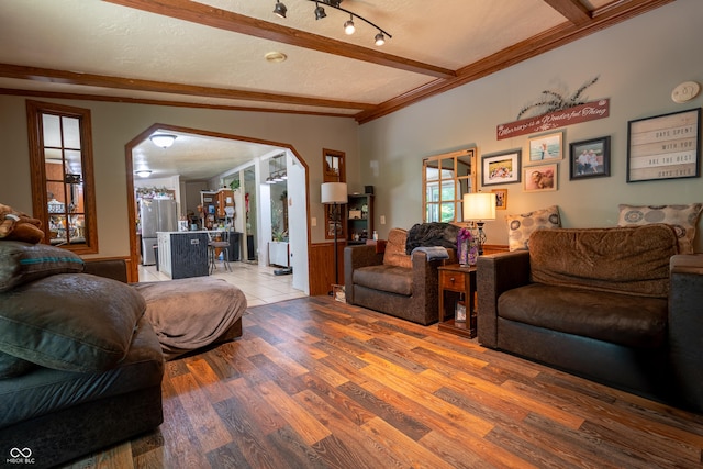 2501 Mitten Rd, Bowling Green, IN 47833 - living area with beamed ceiling, arched walkways, ornamental molding, and wood finished floors