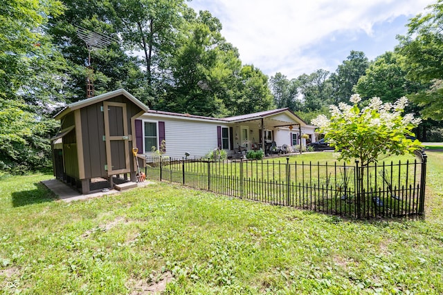 2501 Mitten Rd, Bowling Green, IN 47833 - back of property featuring board and batten siding and view of wooded area